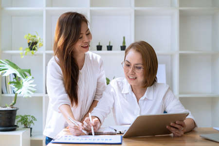 A team of successful businesswoman. Discussion of the important investment plan of the company.の写真素材