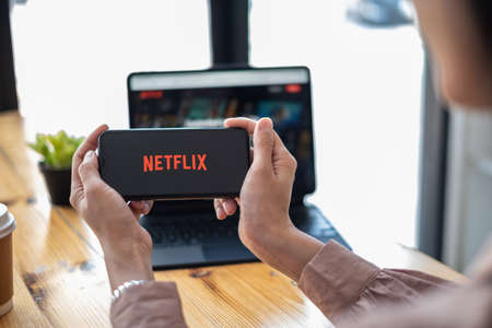 CHIANG MAI, THAILAND OCT 01, 2021 : Netflix logo on iPhone XS screen. Netflix is an international leading subscription service for watching TV episodes and movies.のeditorial素材