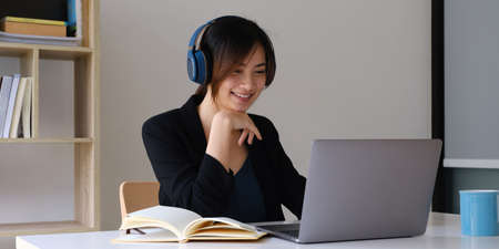 Employer reviewing good cv of prepared skilled applicant. HR manager making hiring decision by video call. Interview concept.の写真素材