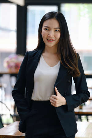 A successful organization as a manager is represented by a happy entrepreneur or businesswoman.の写真素材