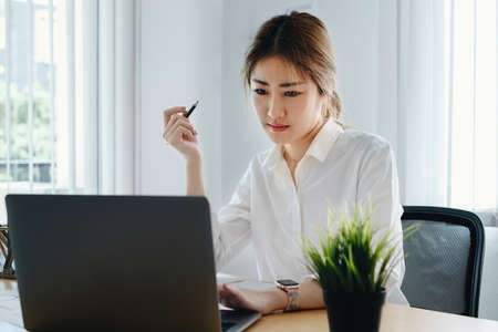 Fund managers researching and analysis Investment stock market by laptop computer. financial concept.の写真素材