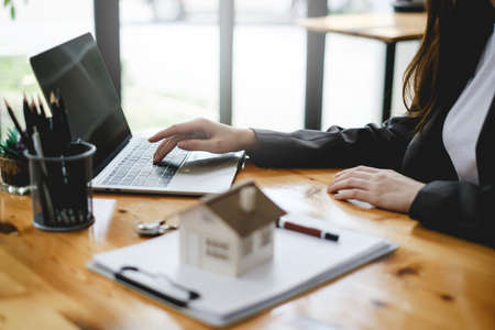 Business people gather in a corporate location to discuss research using paperwork. Concept of a group of businesses cooperating.の写真素材