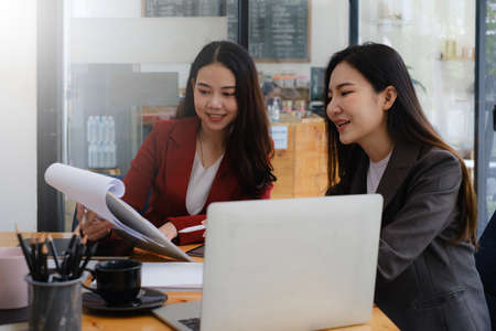 Business team working together and training to analyze technical price graph and indicator. Chart...