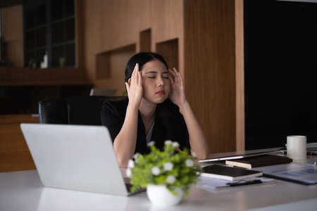 Frustrated stressed business financial or accountant sitting in an office because  has disappoint.の写真素材