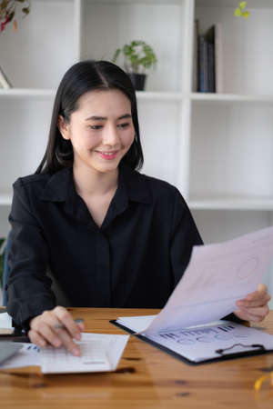 Business woman working to analyze technical price graph and indicator. account or saving money or...