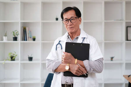 Adult doctor or surgeon in a classroom, ready to instruct.の写真素材