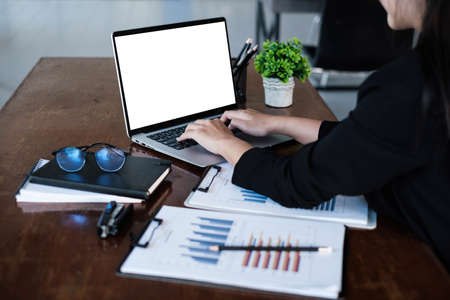 Cheerful young asian woman using laptop computer at home, online shopping, freelance, asia conceptの写真素材