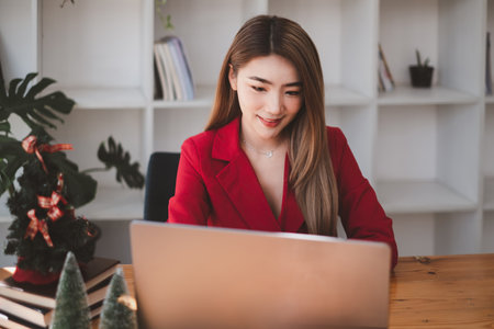 A business woman using laptop computer to cyber security for her saving account, business, technology, future, digital asset Concept.の写真素材