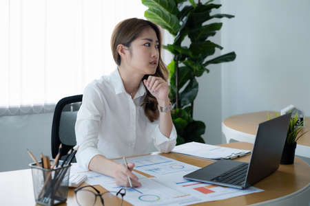 Business woman or accountant making working audit with budget chart on desk. finance and accounting...