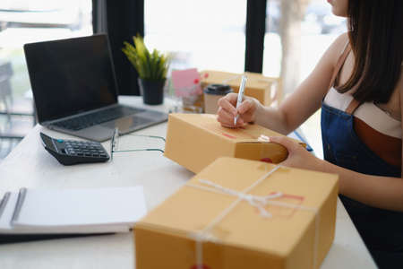 Asian small business owner working at home office. Business retail market and online sell marketing...