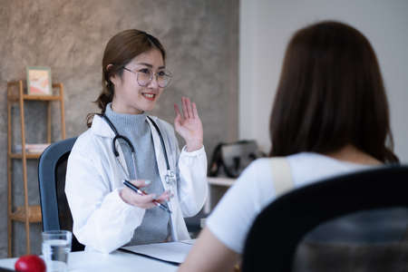 Doctor discussing and explain to patient about life plan. Medicine and health care and insurance concept.の写真素材