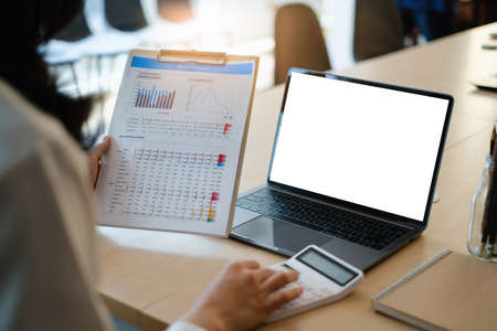 Fund managers researching and analysis Investment stock market by paperwork at meeting room.
