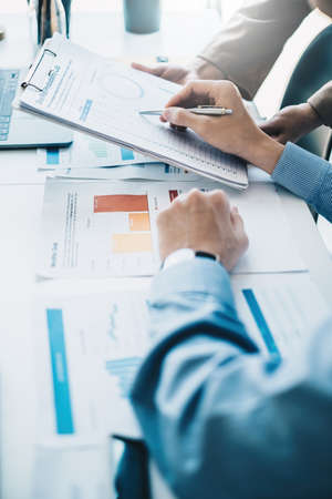 Business team consultation and discuss about analysis stock market at private office. Finance and...