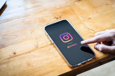 CHIANG MAI, THAILAND - FEB 28, 2022 : A Woman using Instagram application on iPhone. Instagram reels for making short videos from Meta.のeditorial素材