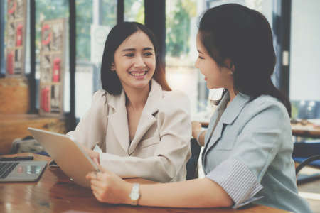 Group of Businesswoman and Accountant checking data document on digital tablet for investigation of corruption account . Anti Bribery concept.の写真素材