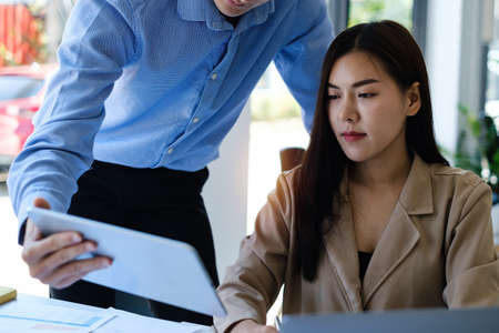 Group of IT consultant working together and management big data and analyze financial document of company.の写真素材