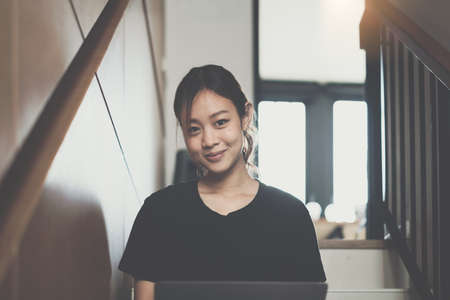 E-learning ,online ,education and internet social distancing protect from COVID-19 viruses concept. Asian woman student video conference e-learning with teacher on laptop computer at homeの写真素材