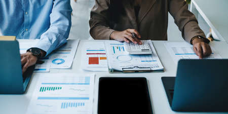 Image of Audit team working together and looking about transaction for corruption of company....