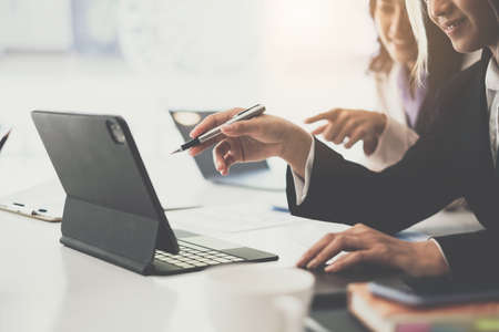 Fund managers team consultation and discuss about analysis Investment stock market by digital tablet. Business Finance concept.の写真素材