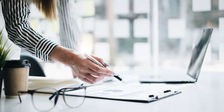 Business woman investment consultant analyzing and audit of company budget. finance and accounting concept.の写真素材