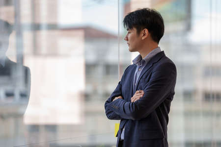 A successful entrepreneur analyzing a technical price graph and indicator. The concept of a bank account, a savings account, or an insurance policy.の写真素材