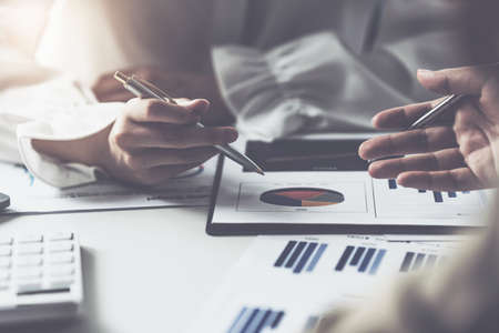 Analytics intelligence concept. Group of business people discuss current financial and economic on laptop for investment at the meeting.の写真素材