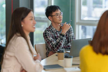 Business team having dicuss and giving some new ideas about project at meeting room.の写真素材