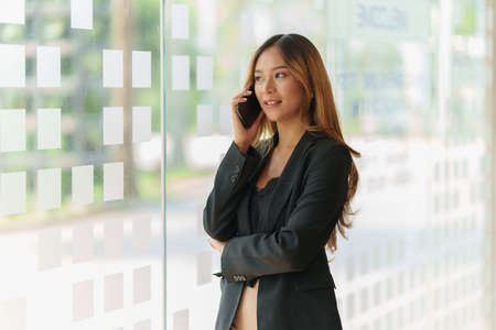 Successful business woman excited when her business growth and good news. Finance concept.