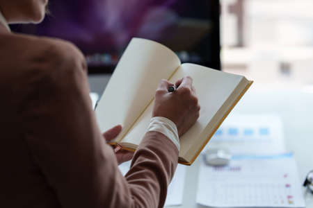 Businesswoman teacher or mentor coach speaking to customer about financing by video call. Finance concept.の写真素材