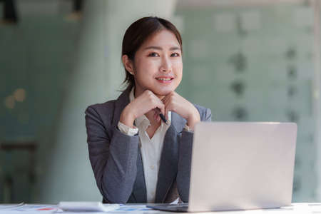 Successful business woman excited when her business growth and good news. Finance concept.の写真素材