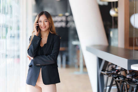 Modern Asian Business woman have confident working with financial at office. Accounting concept.の写真素材