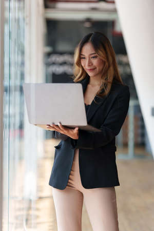 Modern Asian Business woman have confident working with financial at office. Accounting concept.の写真素材