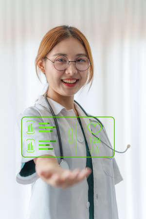 Cardiologist holding red heart in private clinic. Medical technology diagnostics of heart concept.の写真素材