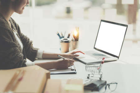 Asian small business owner working at home office. Business retail market and online sell marketing delivery, SME e-commerce concept.の写真素材