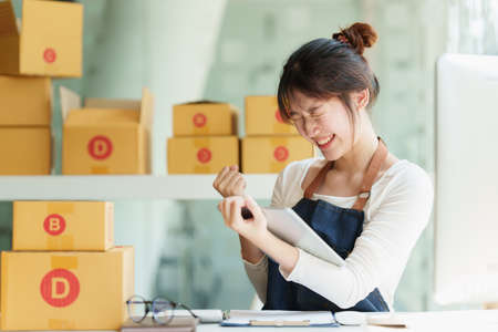 Asian small business owner working at home office. Business retail market and online sell marketing...