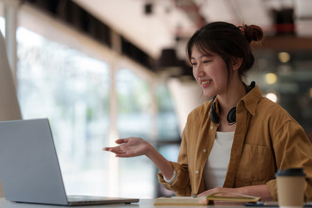 E-learning ,online ,education and internet social distancing protect from COVID-19 viruses concept. Asian woman student video conference e-learning with teacher on digital tablet at home.の写真素材