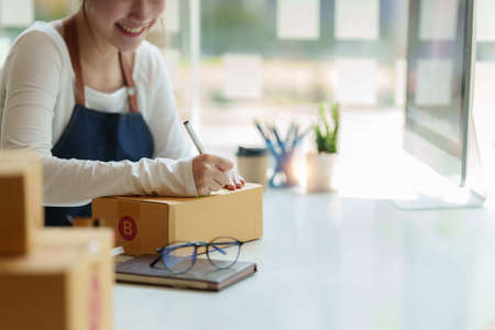 Asian small business owner working at home office. Business retail market and online sell marketing delivery, SME e-commerce concept.の写真素材