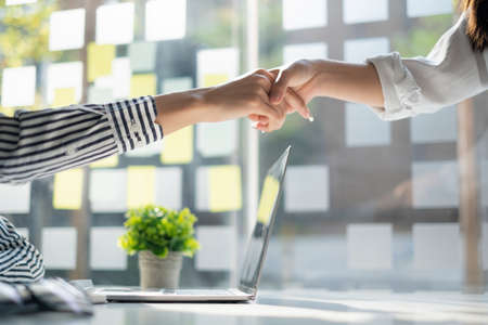 Business partnership meeting concept. Image business women handshake. Successful business people handshaking after good deal. Group support concept.の写真素材