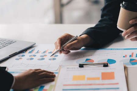 In an open space, a business team or accountant collaborates on an audit transection budget of company.の写真素材