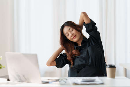 Beautiful Asian Business woman relaxing at modern office.の写真素材