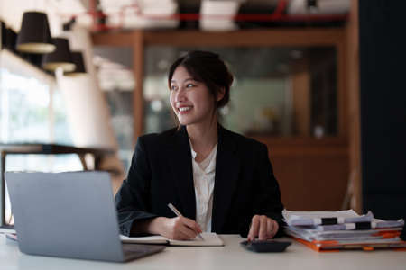 Modern Asian Business woman have confident working with financial team by video conference at...
