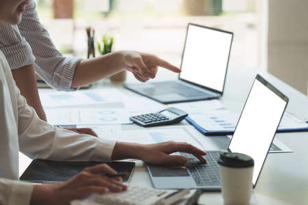 Analytics intelligence concept. Group of business people discuss current financial and economic on...