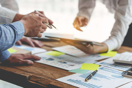 Group of IT consultant working by digital tablet and management big data and analyze financial...