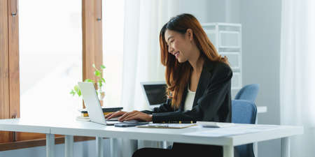 Modern Asian Business woman have confident working with financial at office. Accounting concept.