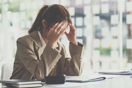 Asian business woman worry about marketing plan of this years. Account, Real Estate Agent, Finance concpet.の写真素材