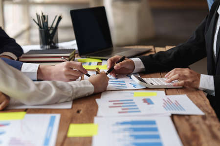 Group of Business people and Accountant checking data document on digital tablet for investigation of corruption account . Anti Bribery concept.の写真素材