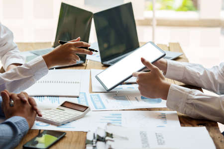 Business People Meeting to discuss and brainstorming the financial report paperwork in home office....