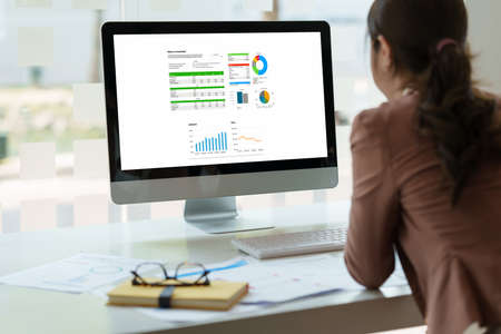 Close up Business woman analyze the companys financial results and budget. Account Audit Concept.の写真素材