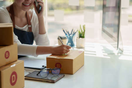 Asian small business owner working at home office. Business retail market and online sell marketing...