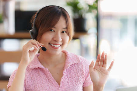 E-learning Online Education concept. Asian woman attentive student student video conference e-learning with teacher on laptop computer at home.の写真素材